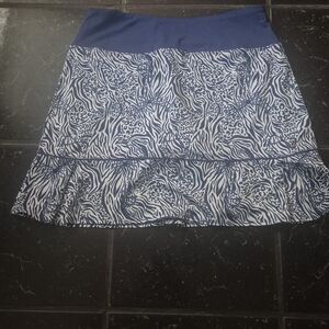 Birdies and Bows ladies golf skirt in a blue and white zebra/cheetah print.